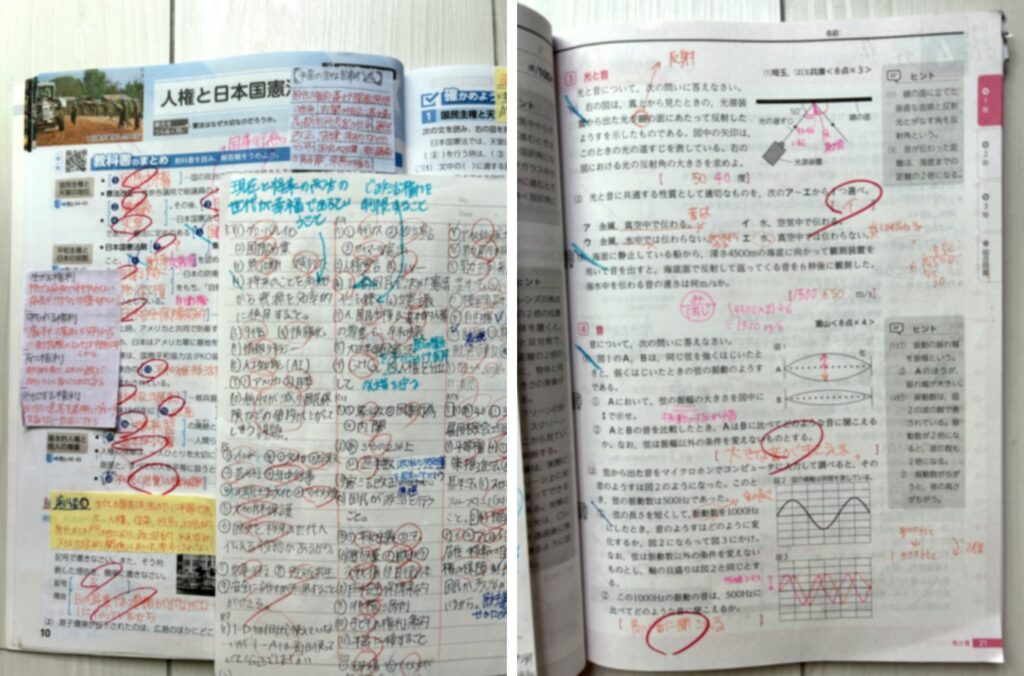 娘が実際に3周した学校のワークと、答えを書いたノート(赤ペンの書き込みと付箋)
